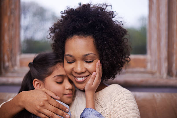 A mother nad her daughter hugging.